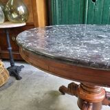 Round pedestal table with marble top and mahogany tripod from the 19th century