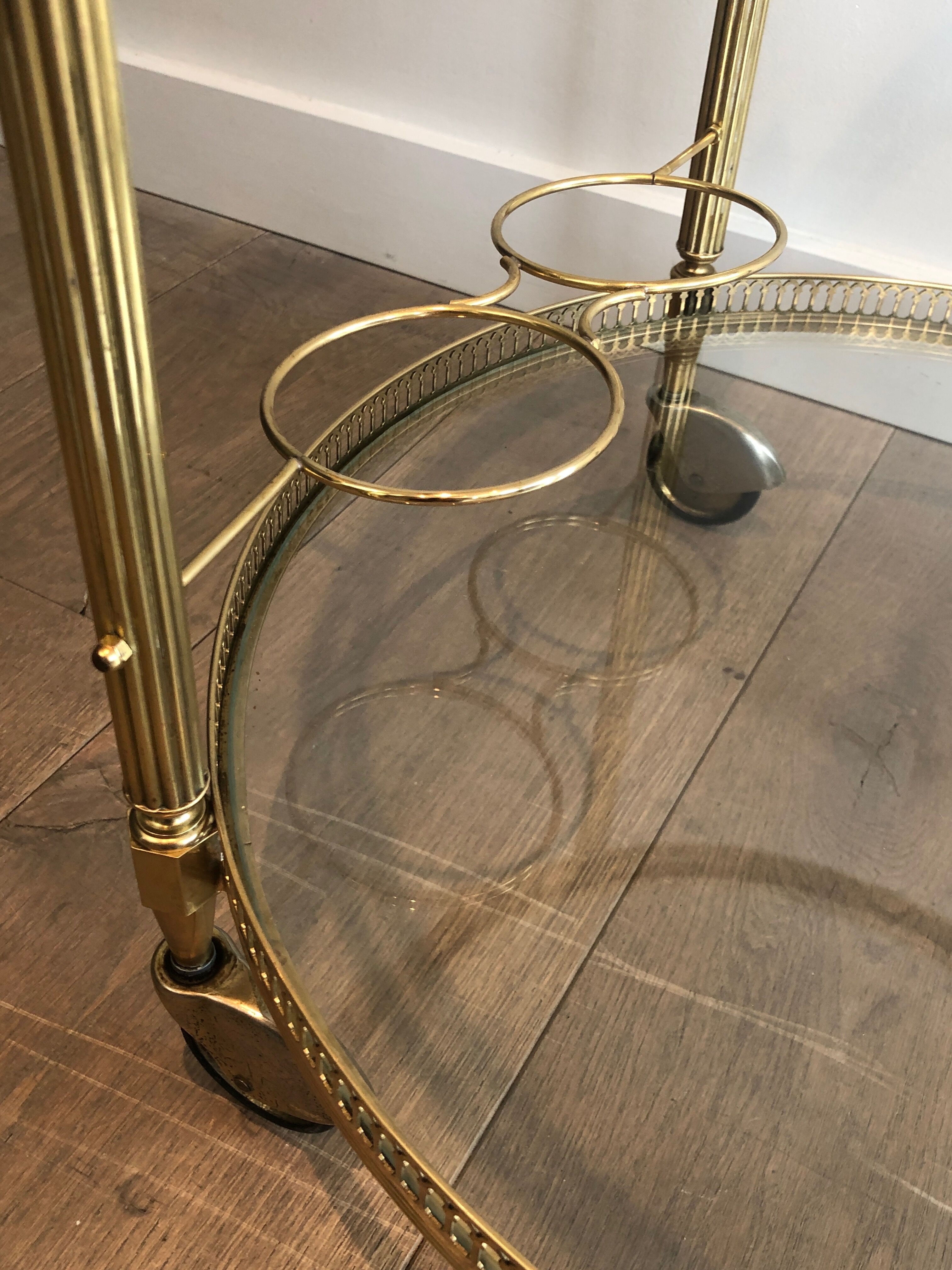 Neoclassical style rolling table in brass
