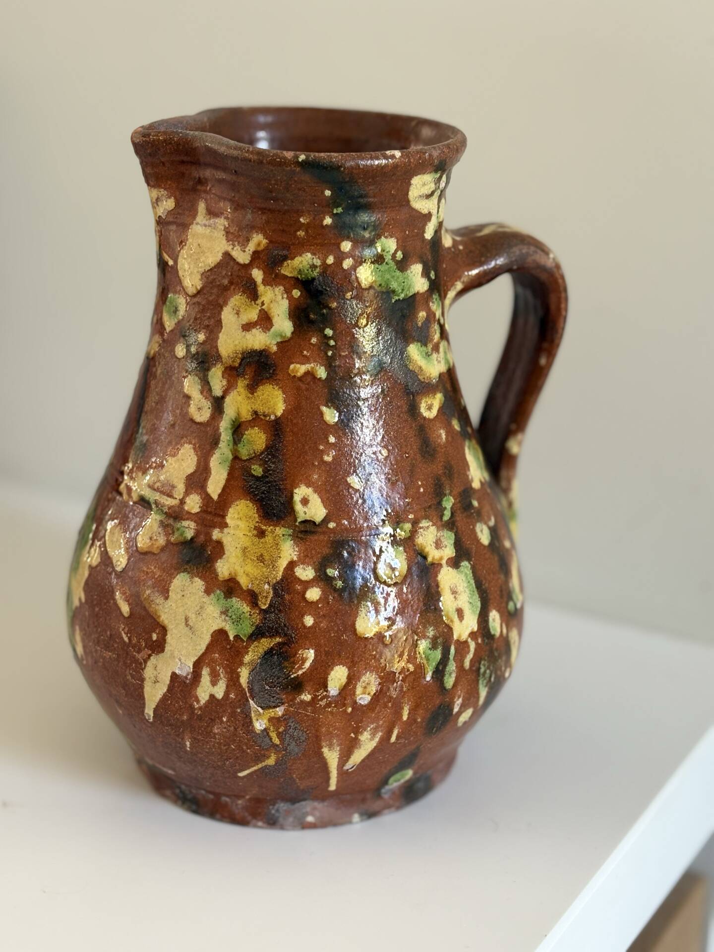 Studio ceramic pitcher with sprayed glazes – circa 1960-70