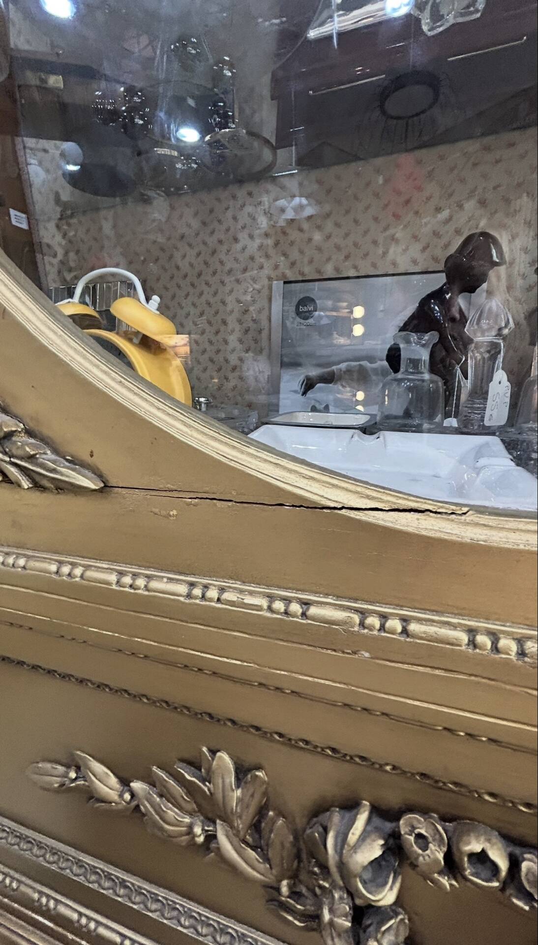 French antique Louis XVI display cabinet in gilded wood with curved glass sides.