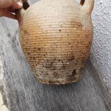 Old terracotta pot with two handles