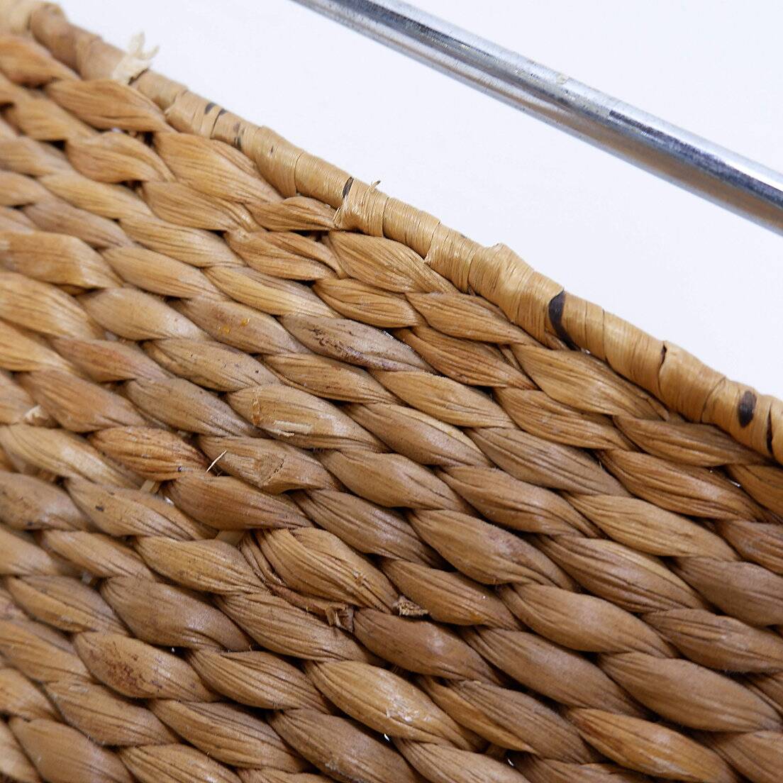 Chrome metal magazine rack with woven banana leaves