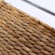 Chrome metal magazine rack with woven banana leaves
