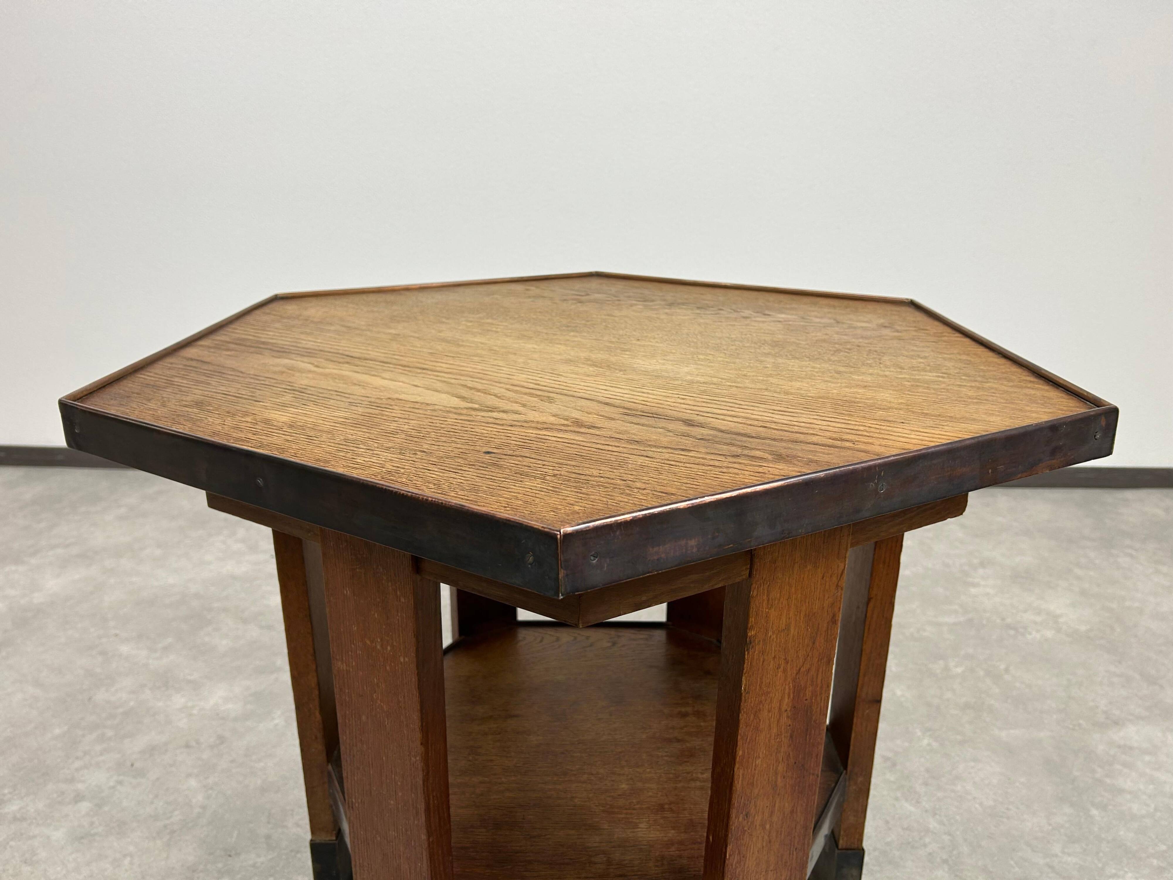 Hexagonal table with six legs in Secession style bordered with brass, attributed to Adolf Loos.