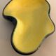 Yellow and black ceramic ashtray