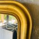 Large antique mirror with gold leaf in the Louis XV style.