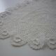 Oval white placemat in crocheted cotton