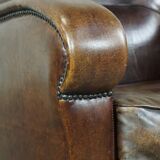 Sheep leather armchair with round shapes
