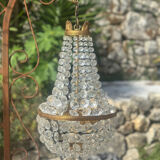 Basket chandelier with crystal and gilded brass pendants, circa 1930.