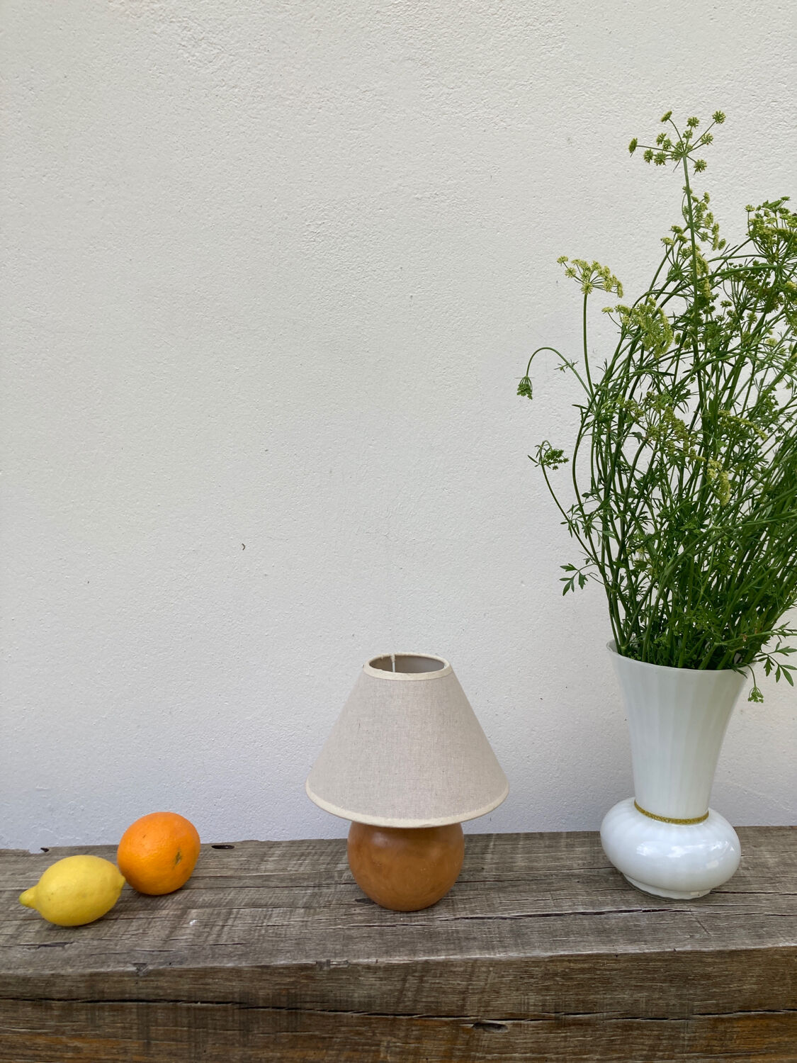 Wooden ball bedside lamp and beige lampshade