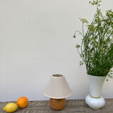 Wooden ball bedside lamp and beige lampshade