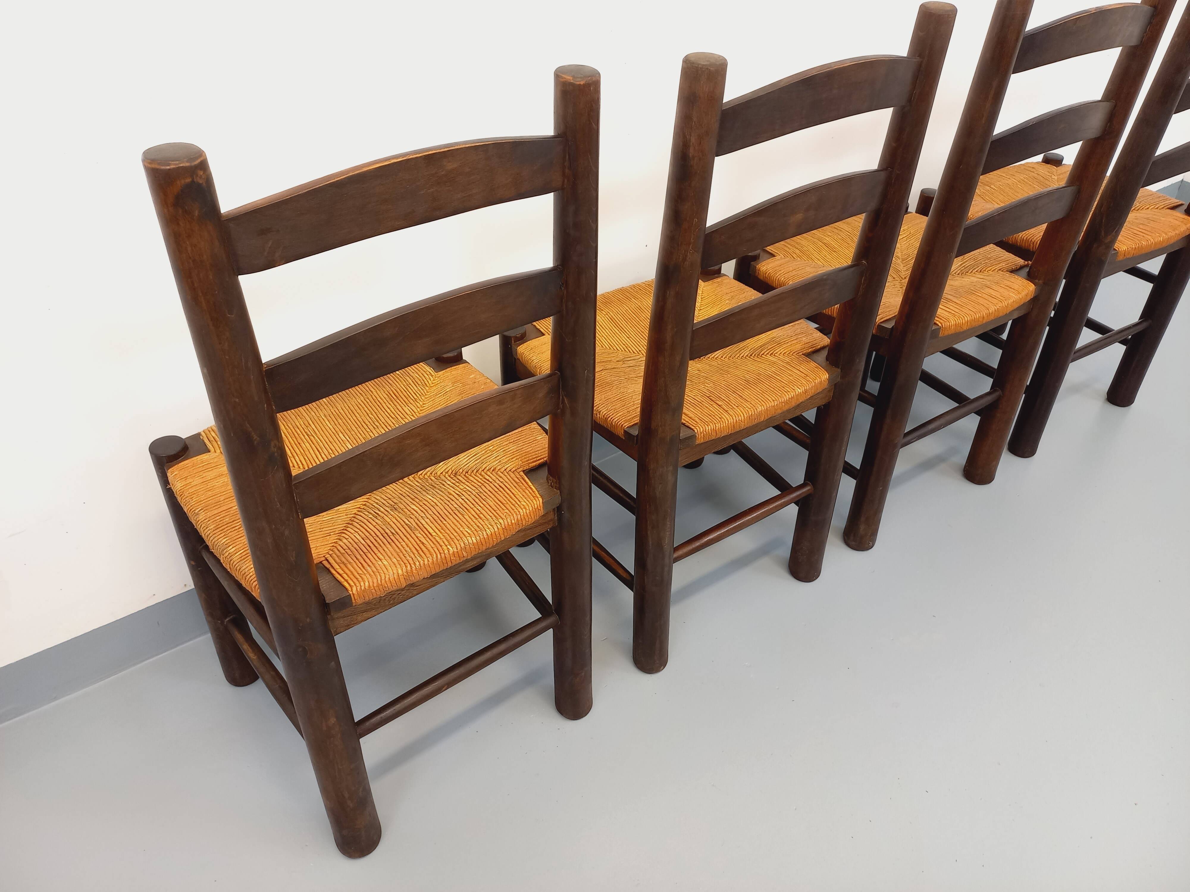 Set of 4 vintage brutalist chairs by Georges Robert in wood and straw.