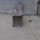 Low stool in vintage brown painted pine from the 1940s, with a rectangular seat.