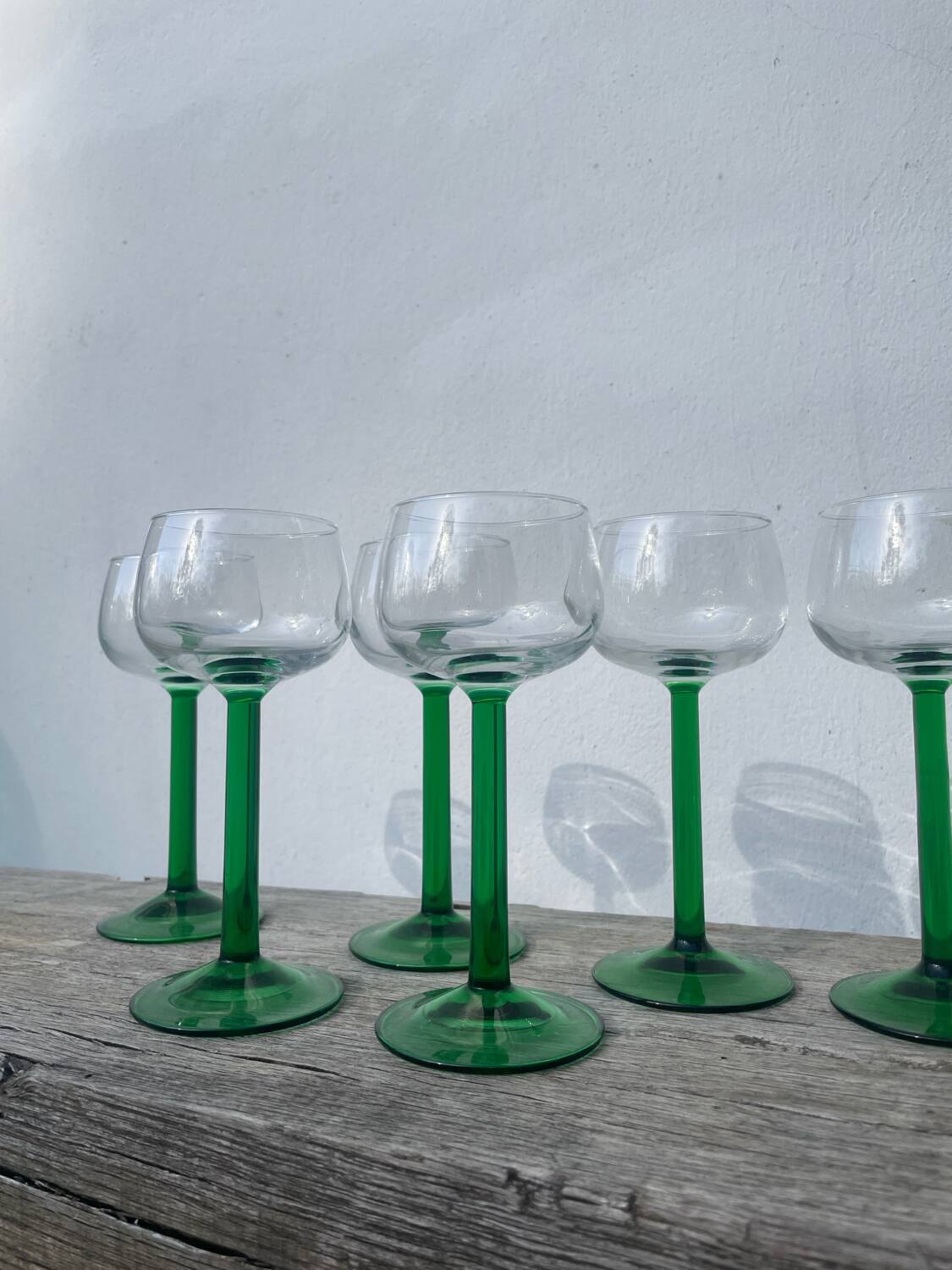 7 green glass stemmed glasses