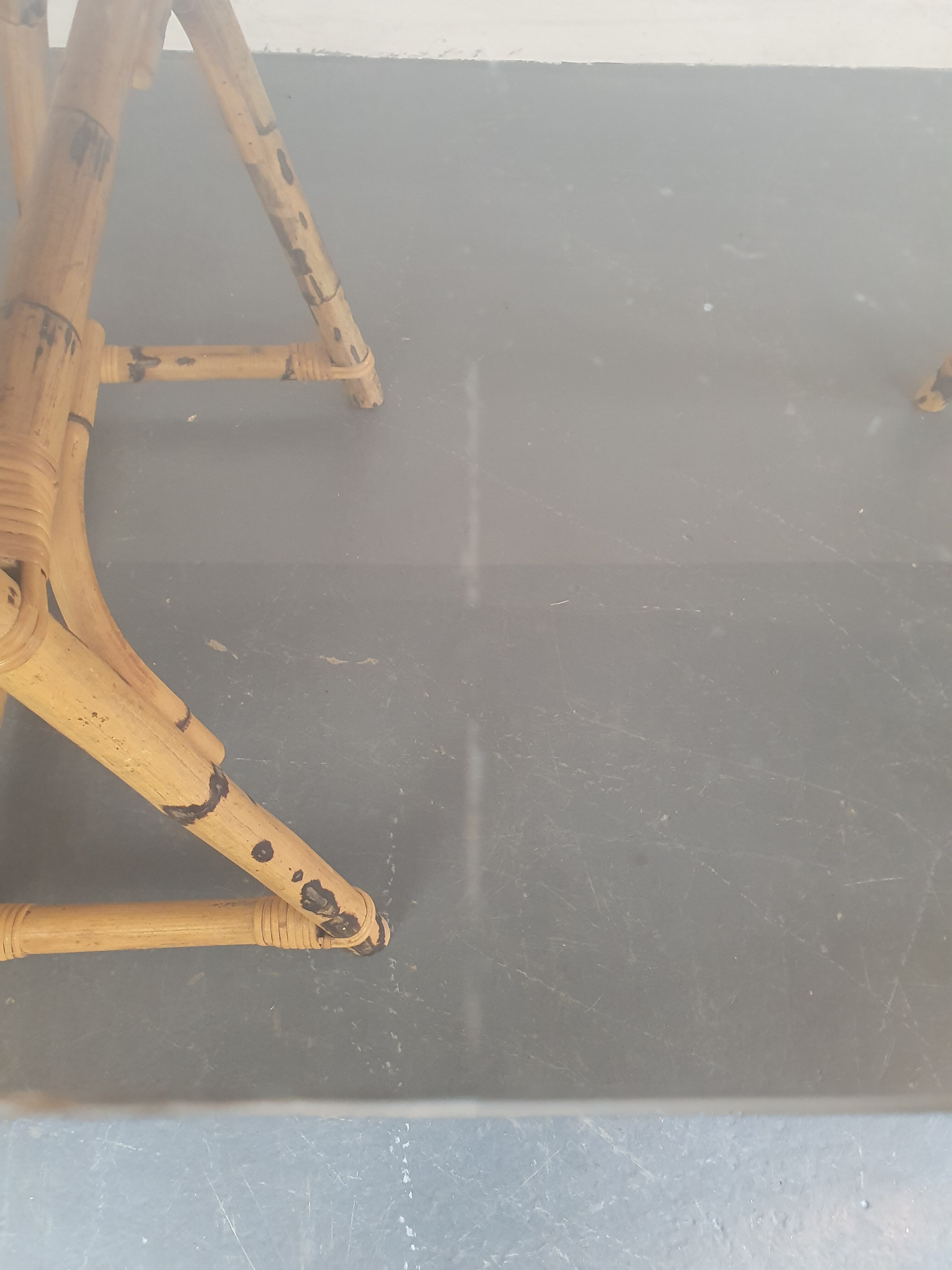 1970s dining table with bamboo trestle legs and smoked glass