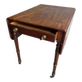 Antique drop-leaf side table on wheels