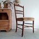 Antique chair turned wood sitting velvet flowers