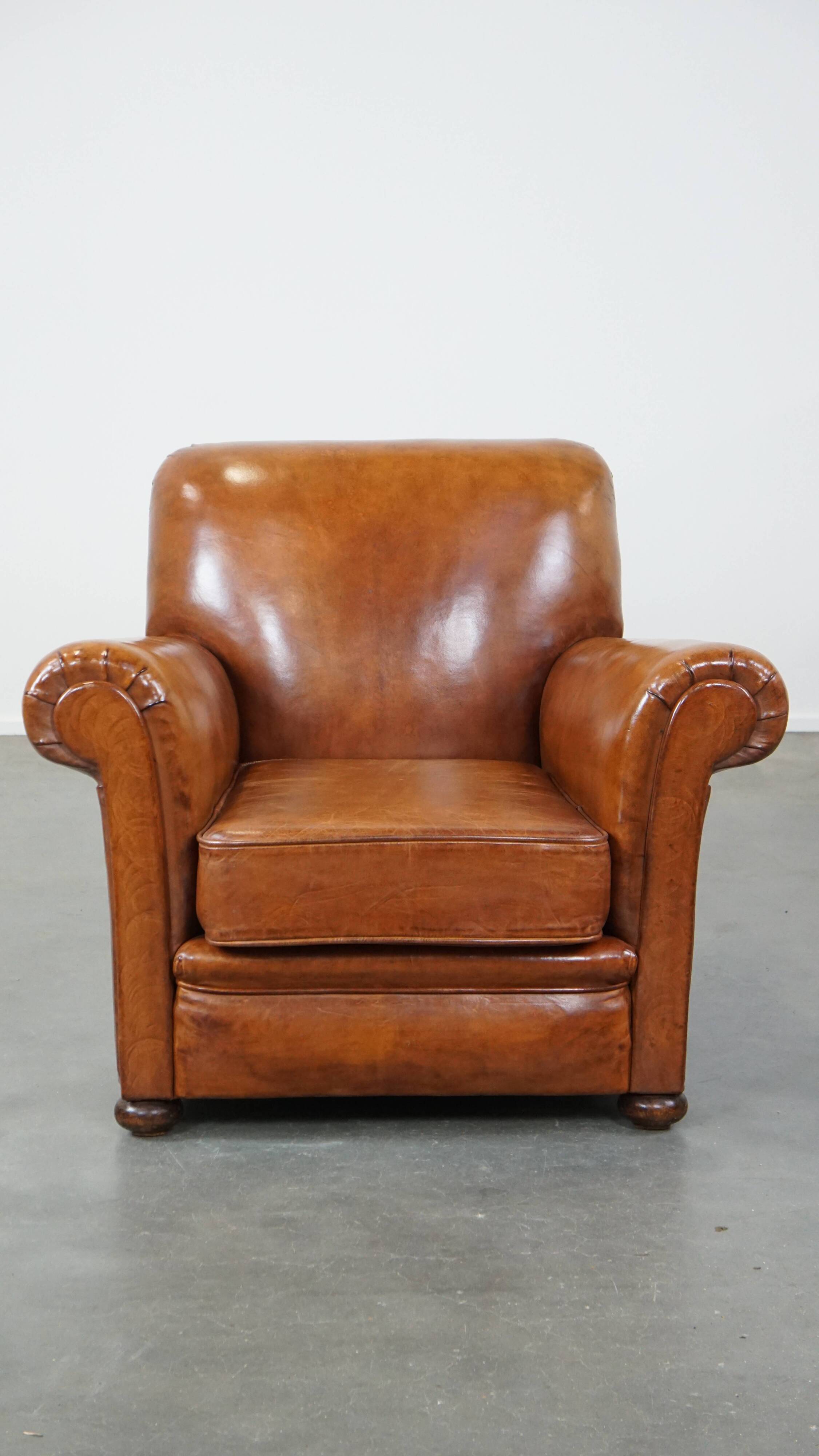 Cognac-colored antique sheep leather armchair