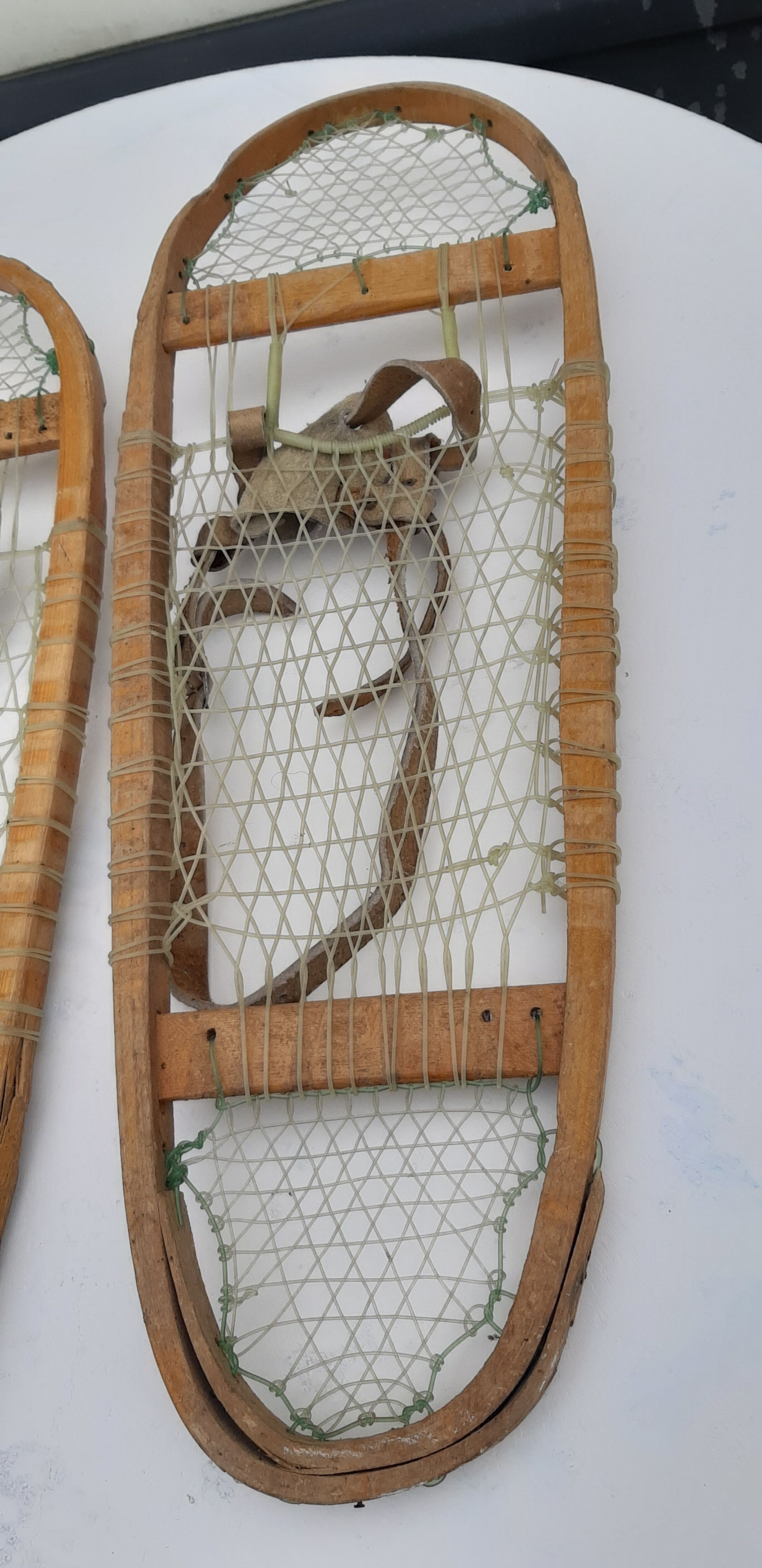 Old snowshoes made of wood and hoses