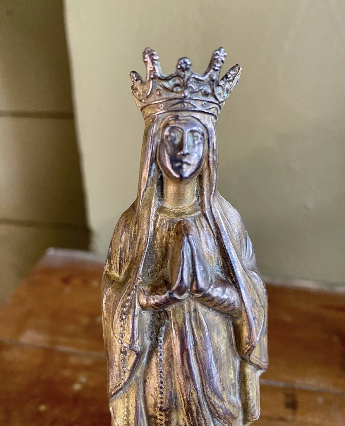Virgin Mary crowned in metal and brass