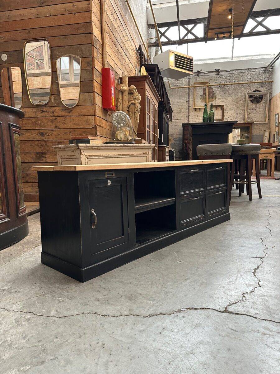 Old workshop furniture transformed into a TV unit.