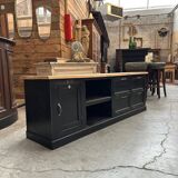 Old workshop furniture transformed into a TV unit.