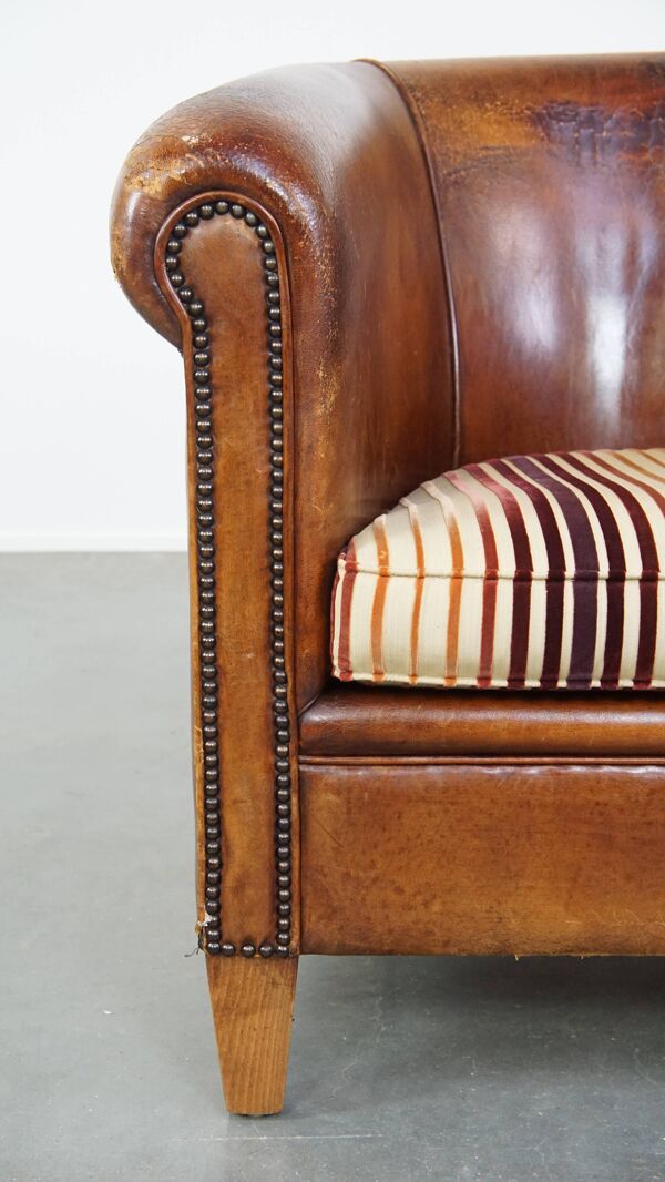 Fauteuil club vintage couleur cognac en cuir de mouton