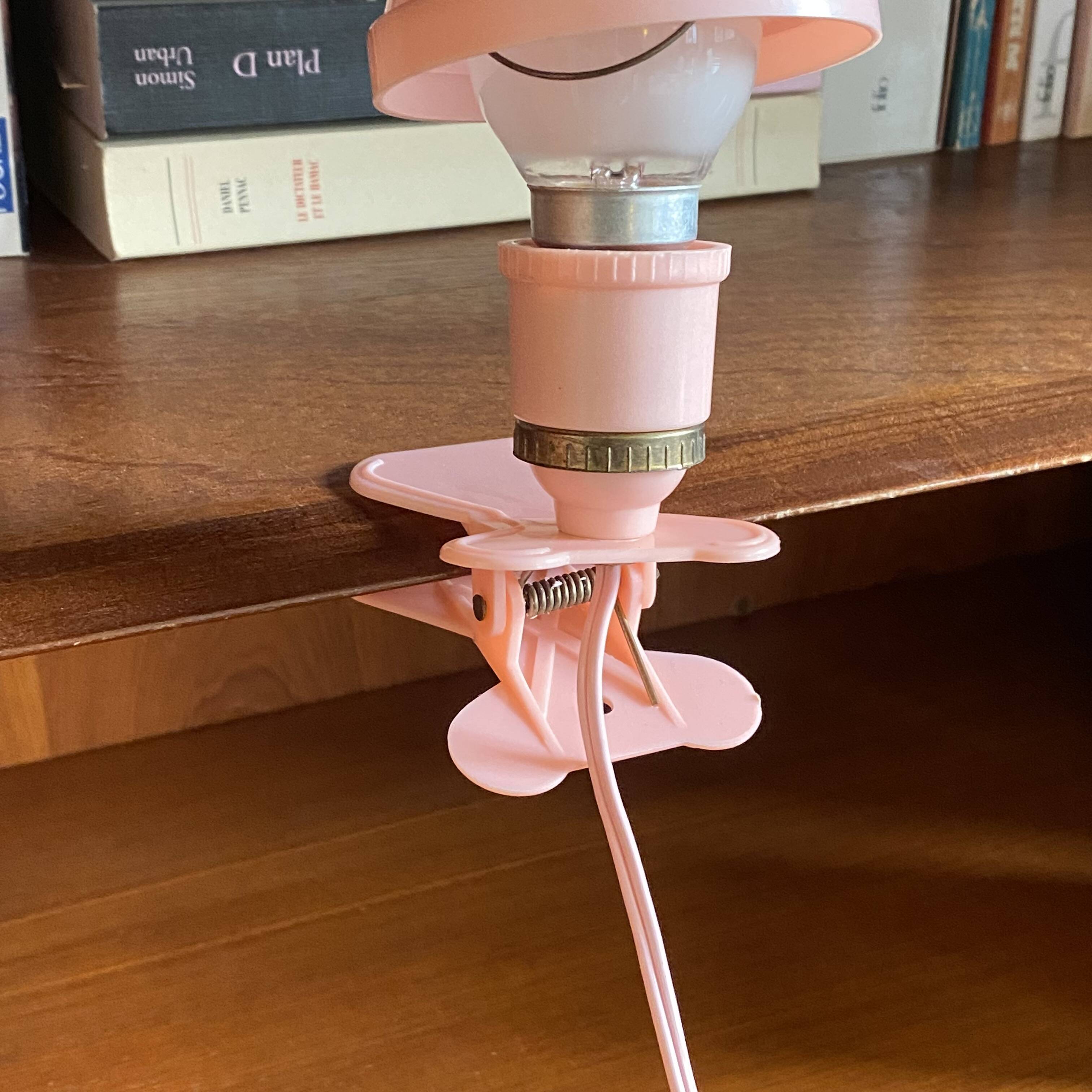 Small portable pink plastic mushroom clip-on lamp
