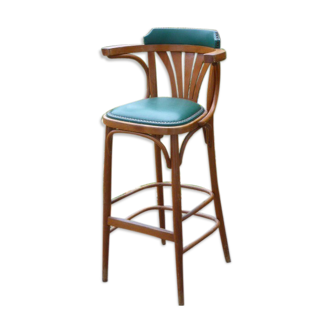 Bar stool in green leather and curved wood