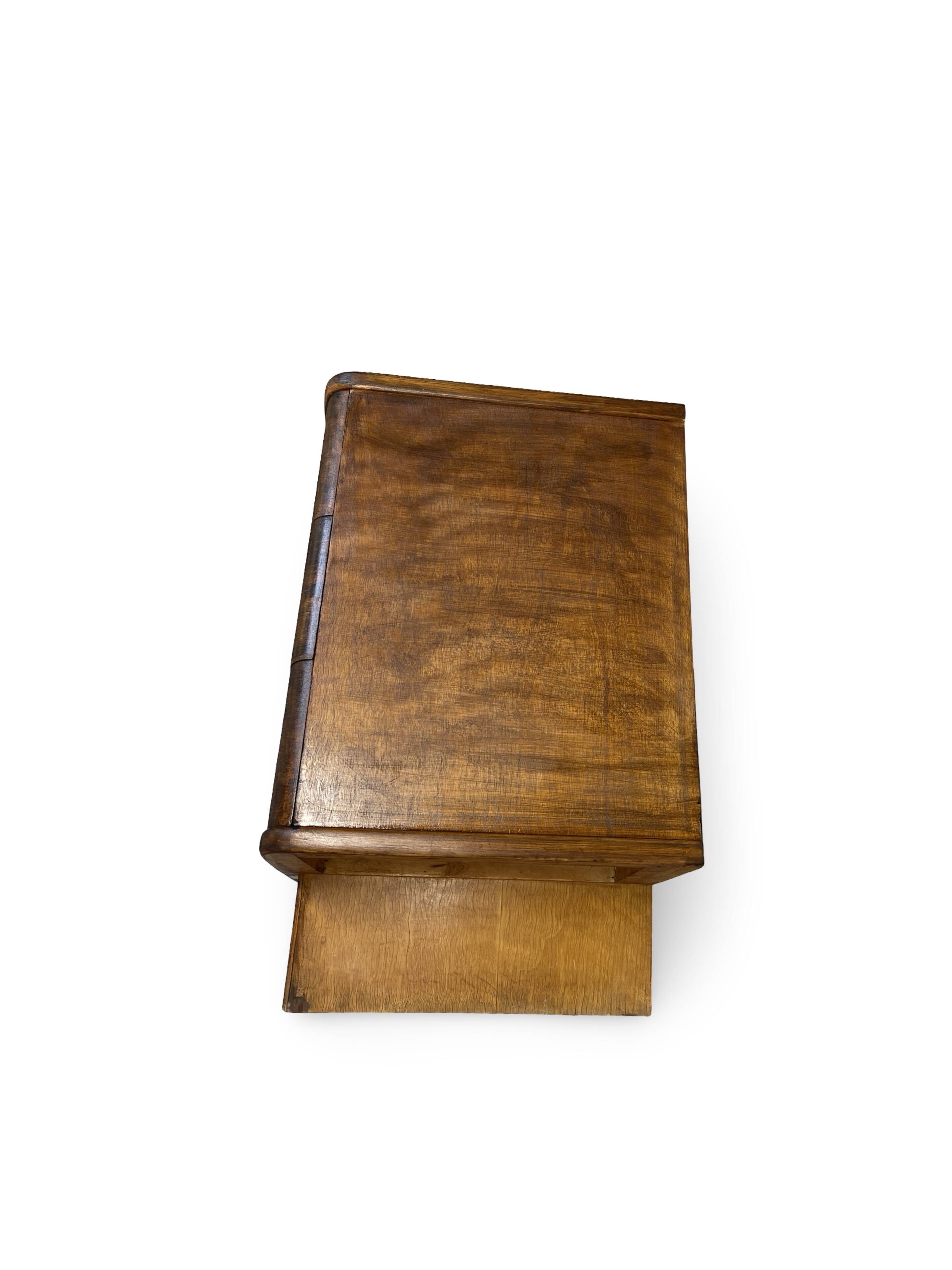 A vintage Italian chest of drawers, made of veneered walnut and solid wood,