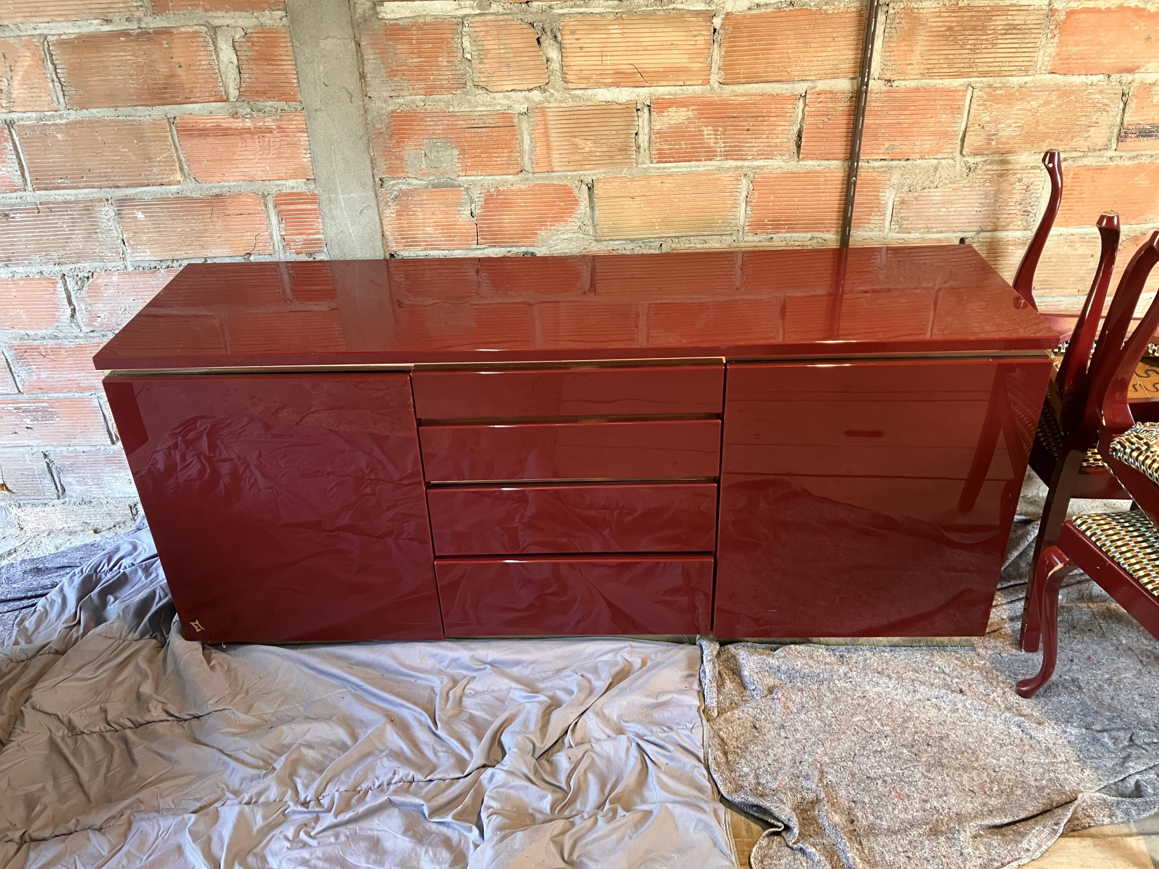 Burgundy lacquered vintage enfilade and brass by Eric Maville