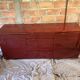 Burgundy lacquered vintage enfilade and brass by Eric Maville
