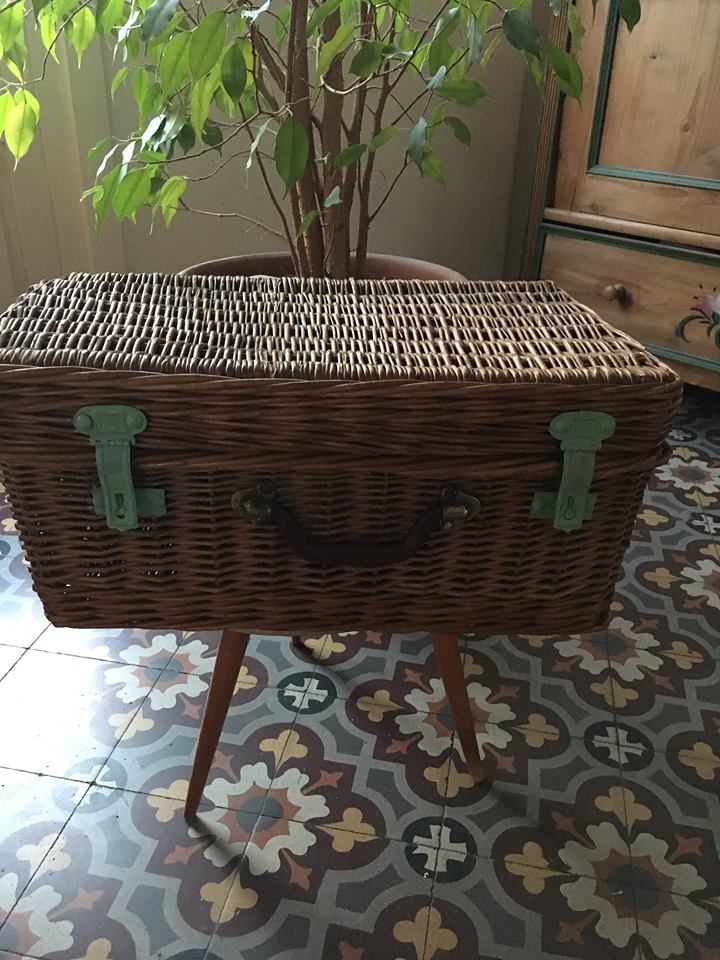 Wicker suitcase to store toys.