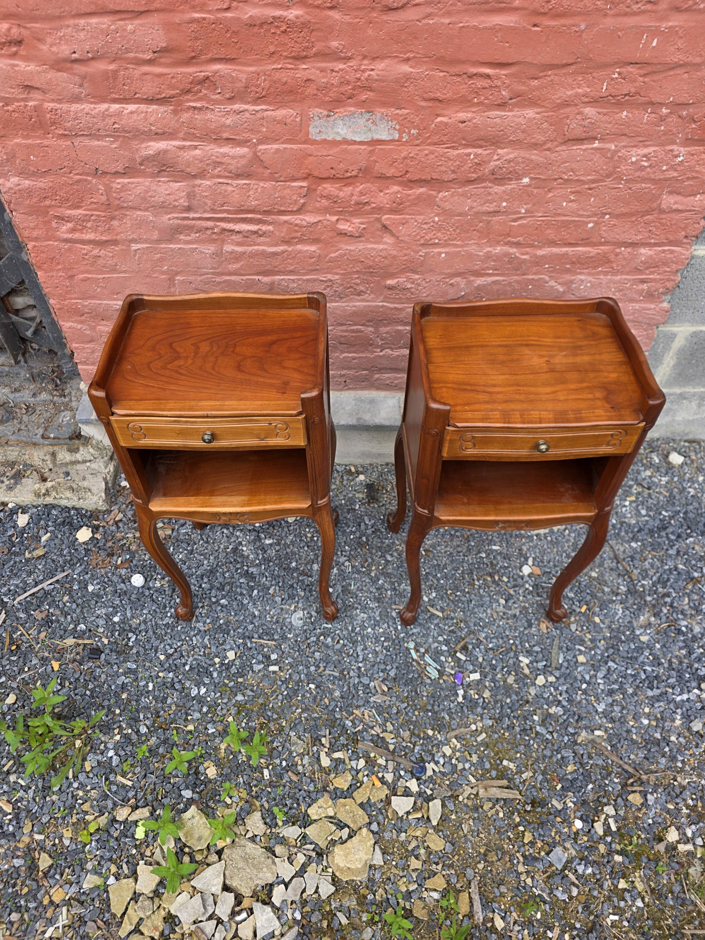 Pair of Louis XV style bedside tables in cherry wood.