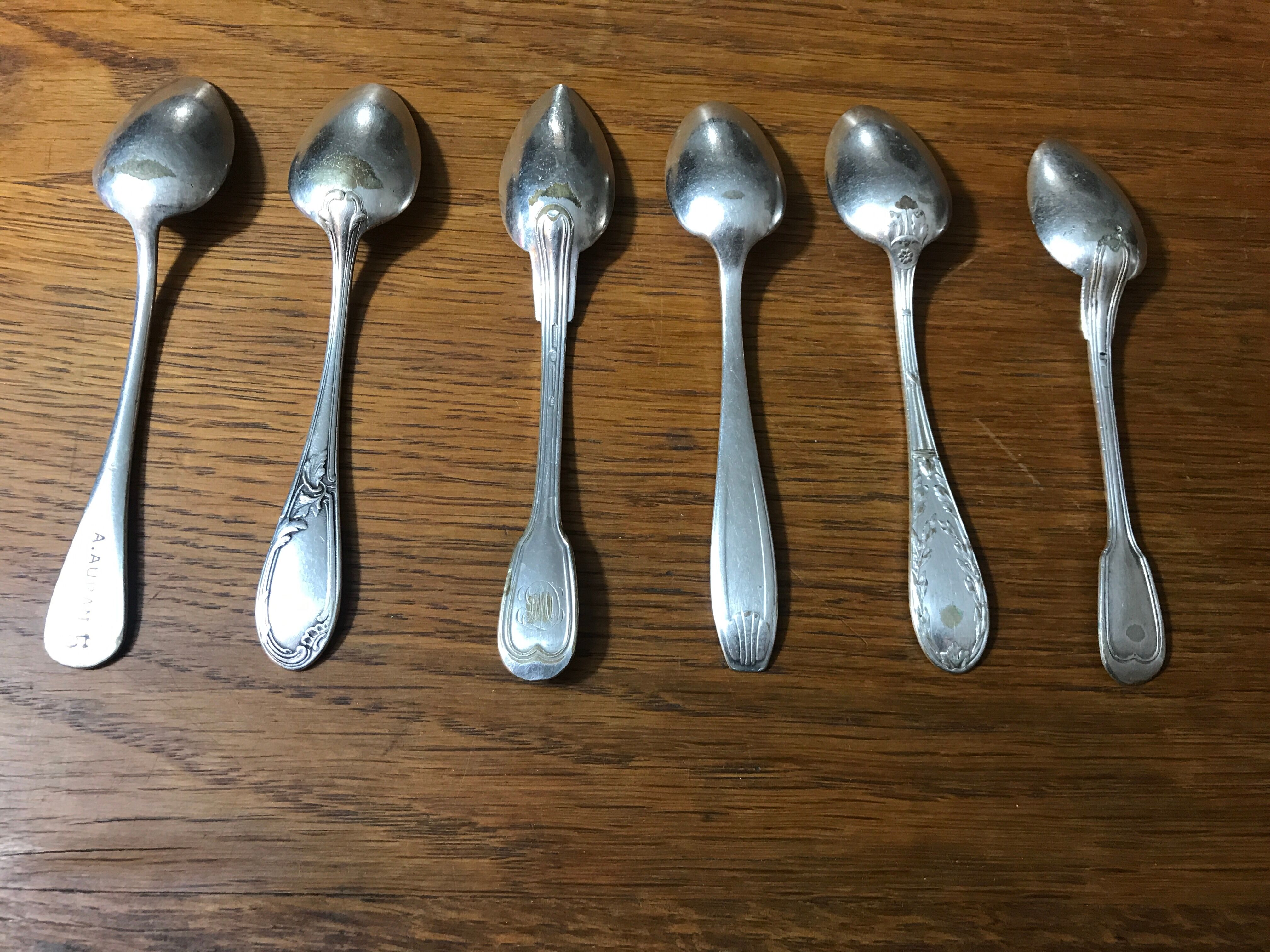 6 small mismatched silver metal spoons