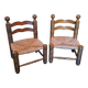 Pair of low fireplace chairs in turned wood and straw, Charles style.