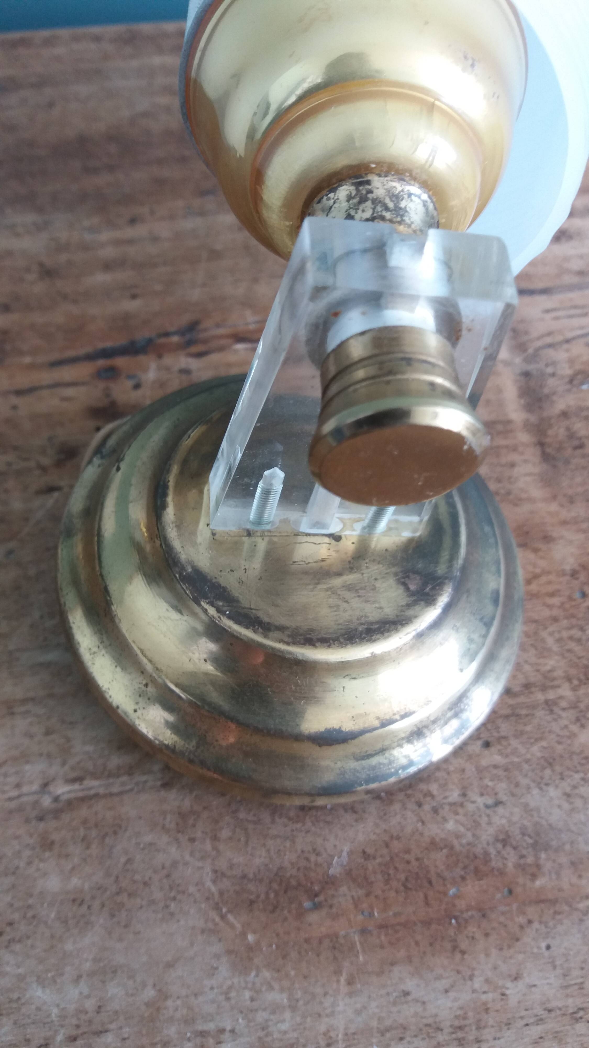 Golden metal appliques and plexiglass perspex in the style of Maison Lunel or Guariche.