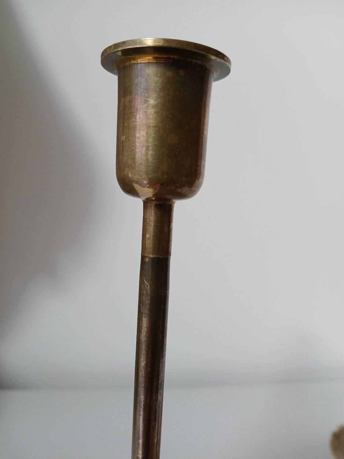 Set of two straight brass candlesticks.