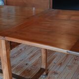 Elm farmhouse table with extensions for 6 to 10 people.