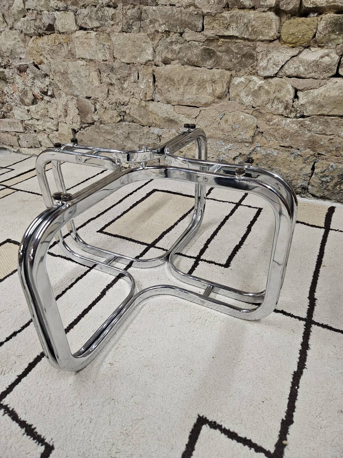 Round chrome coffee table with smoked glass