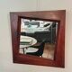 Grand miroir mural en bois exotique massif