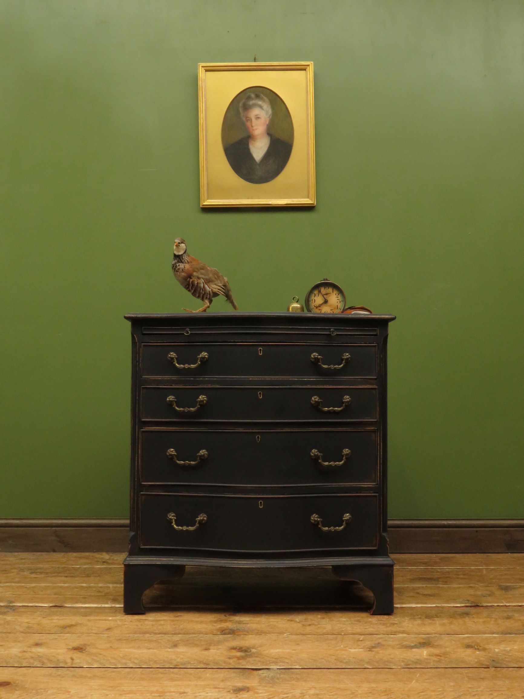 Antique black painted serpentine bachelors chest of drawers