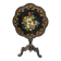 Blackened wooden side table decorated with a painted bouquet of flowers.