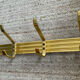 Golden wall-mounted coat rack from the 70s.