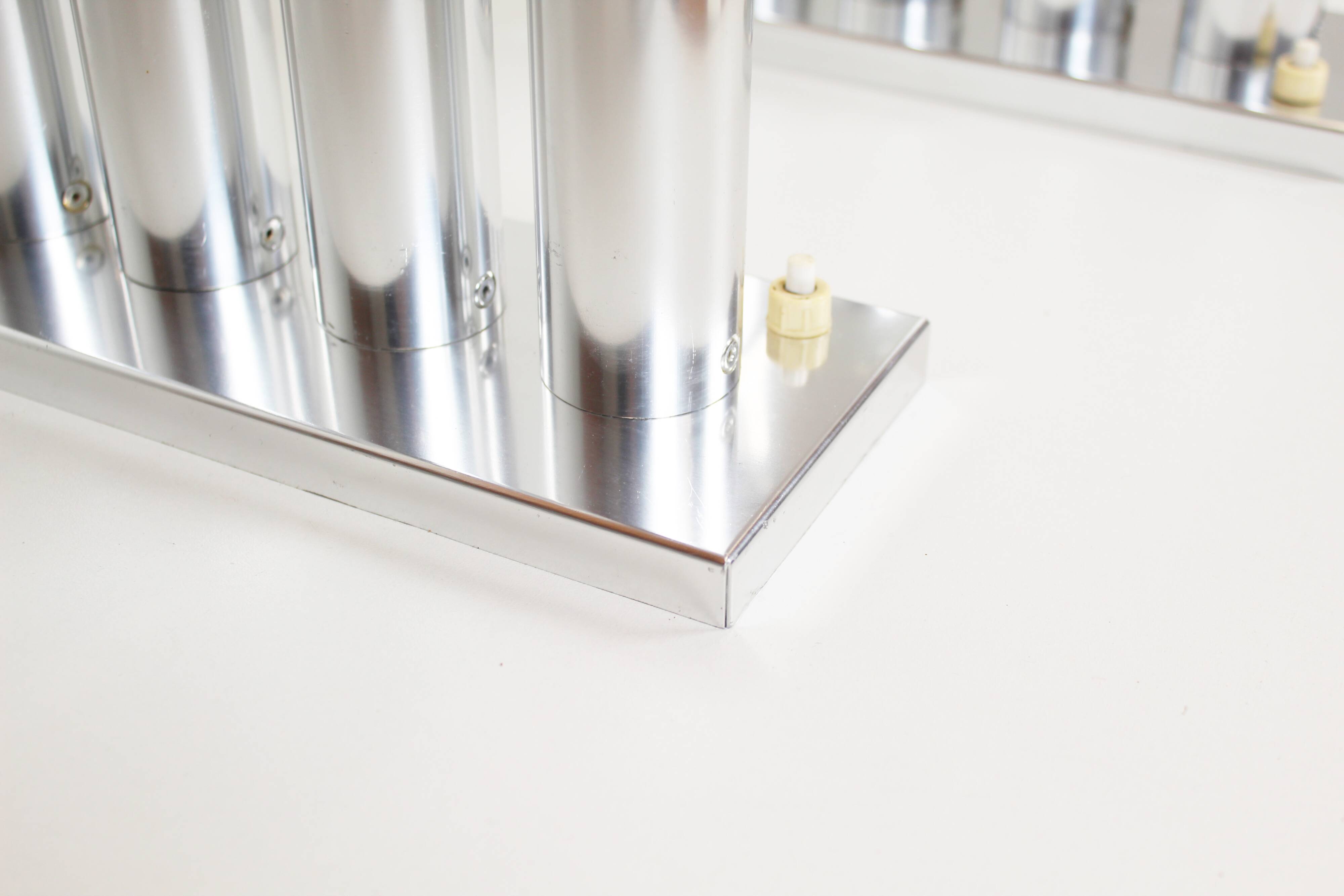 Pair of polished wall lamps by Gaetano Sciolari