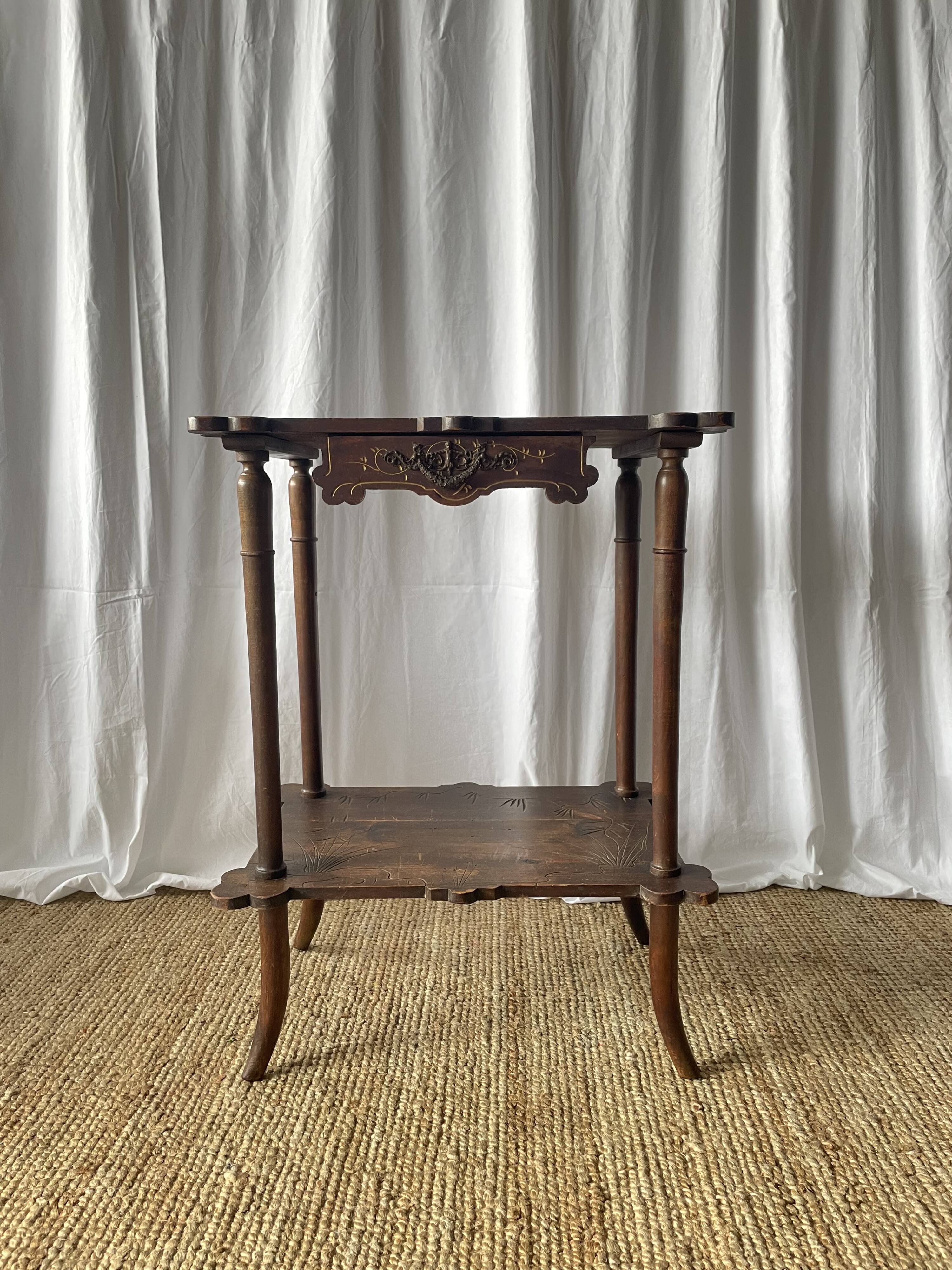 Elegant Art Nouveau side table in walnut, France early 20th century.