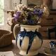 handcrafted ceramic jug with navy blue drip glaze.