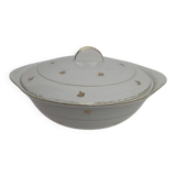 White earthenware soup tureen with a golden pattern.