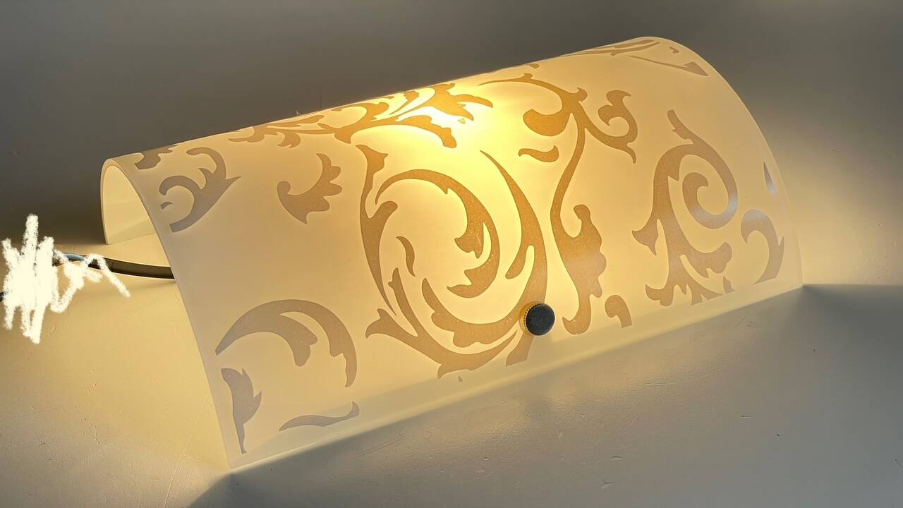 Polished and screen-printed glass sconce by eglo