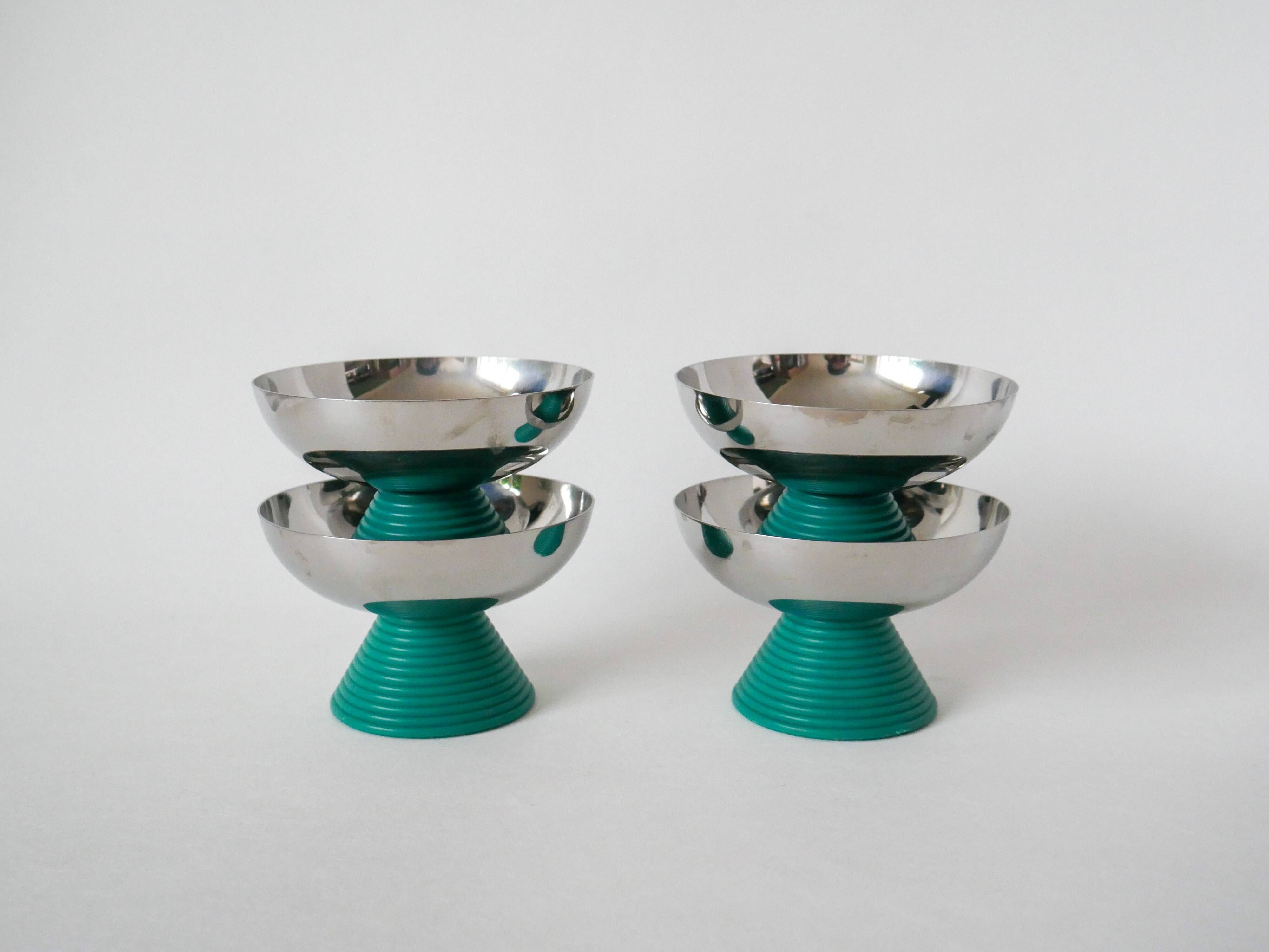 set of 4 large stainless steel bowls and green plastic feet 1970